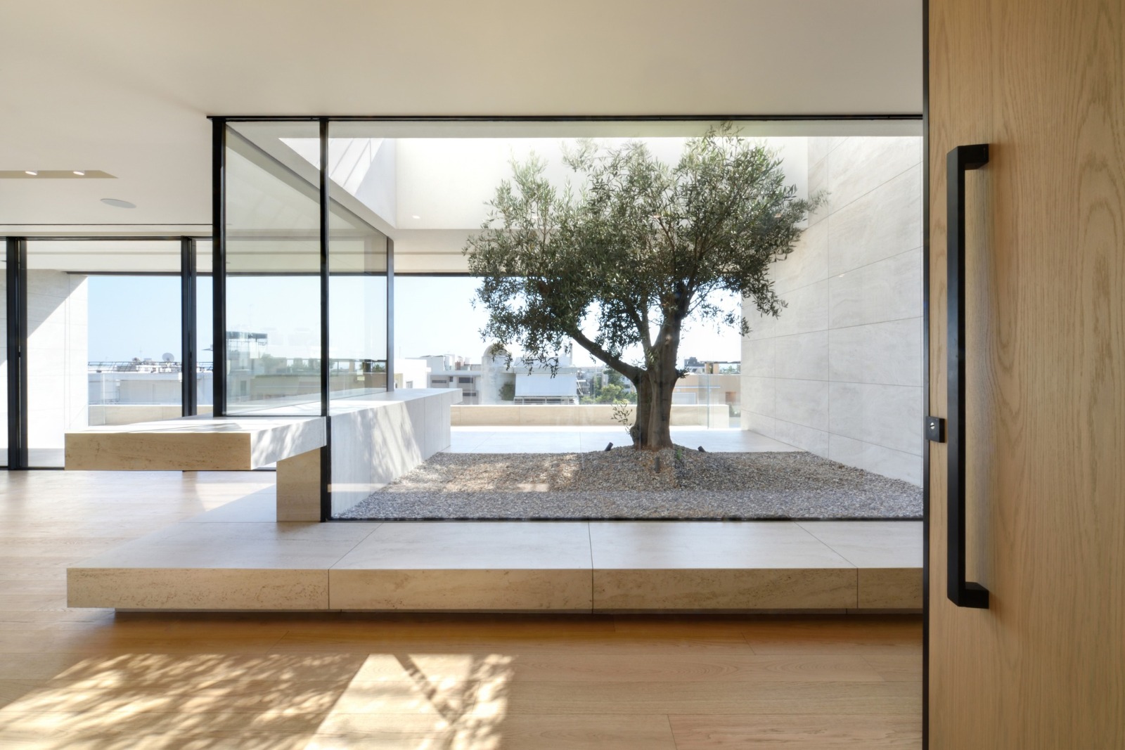 ISV interior — floor-to-ceiling glazing and hardwood floors